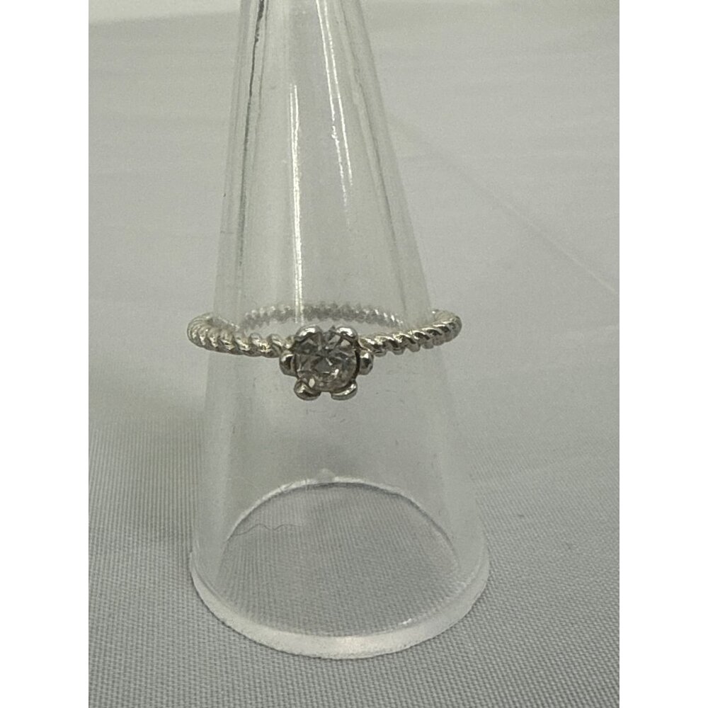 Silver Tone Twisted Band Ring With Clear Stone